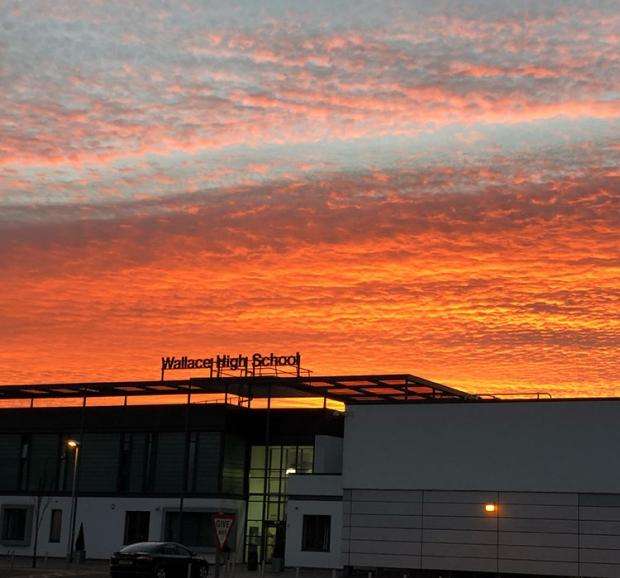 Exterior view of Wallace High School at sunset