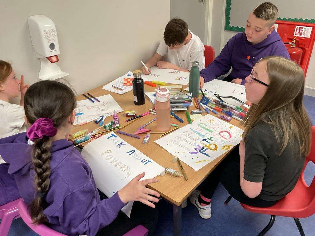 A cost of the school day group taking part in an activity